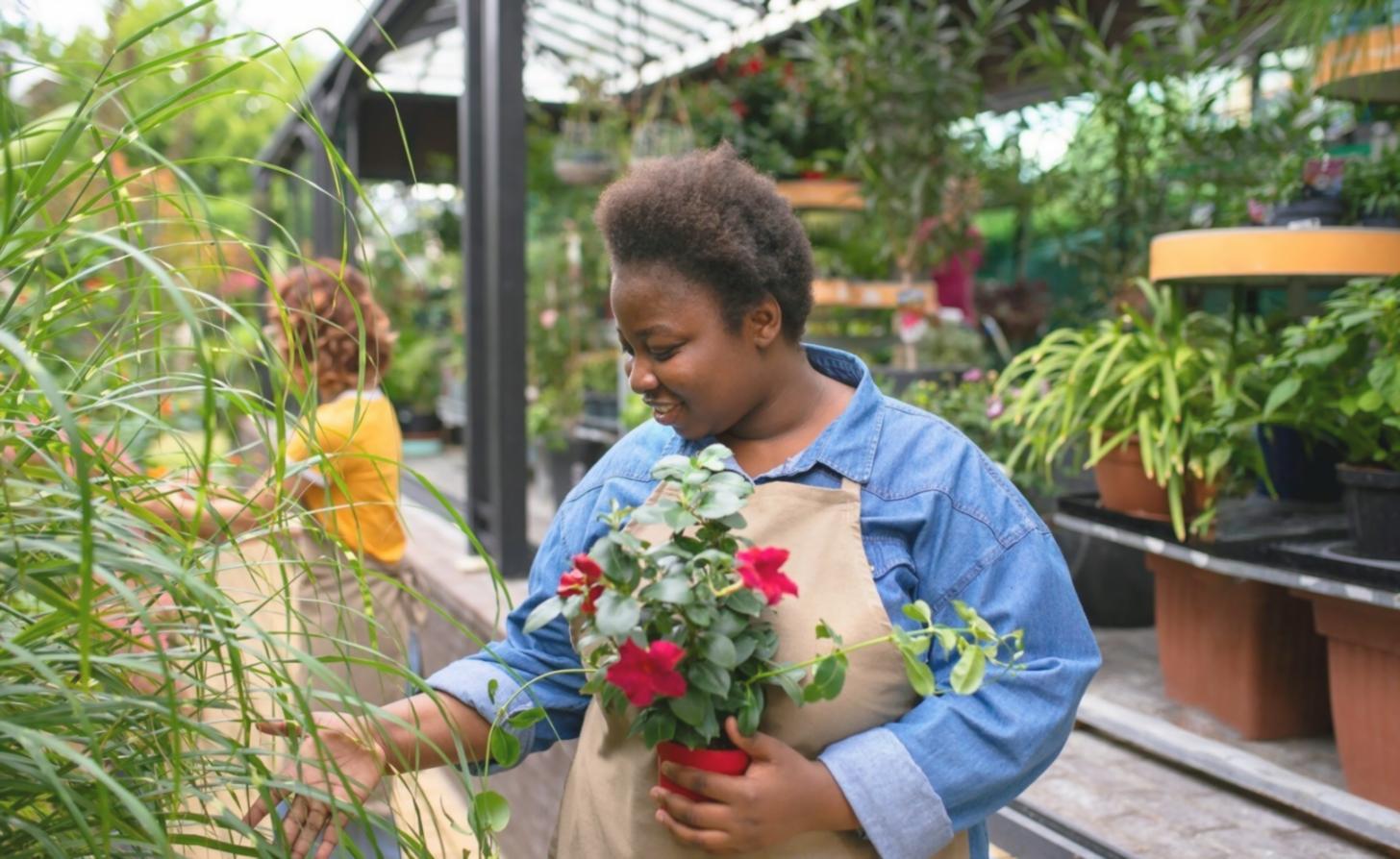 Workshop scene showing multiple bouquets in various stages of completion